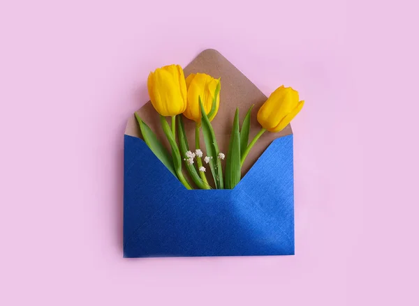 envelope, flower tulip on a colored background