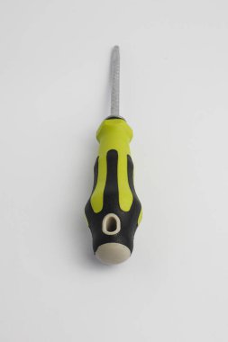 Professional green and black hand tool screwdriver for household repair, engineering, and mechanical design concepts. Isolated on white. 