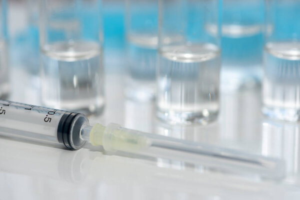 Coronavirus vaccine: covid-19 bottle vaccination. Coronavirus vaccine: covid-19 vaccine bottle vaccination and syringe to inject the vaccine