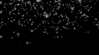 Beyaz kar tabakası siyah arka planda izole edilmiş kar taneleri bokeh, ve Noel ve tatil tasarımı için kar yağışı. 4k Kusursuz döngü