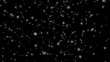 Beyaz kar tabakası siyah arka planda izole edilmiş kar taneleri bokeh, ve Noel ve tatil tasarımı için kar yağışı. 4k Kusursuz döngü