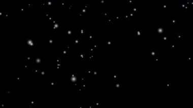 Beyaz kar tabakası siyah arka planda izole edilmiş kar taneleri bokeh, ve Noel ve tatil tasarımı için kar yağışı. 4k Kusursuz döngü