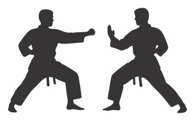 İki kişinin karate çalışmasının silüeti.
