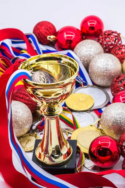 medals and cups, winter competitions, new year\'s holidays, sports awards and new year\'s toys, red Christmas balls,
