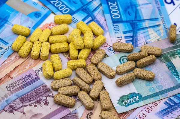 pills and rubles, high cost of medicines, pills and money, treatment costs