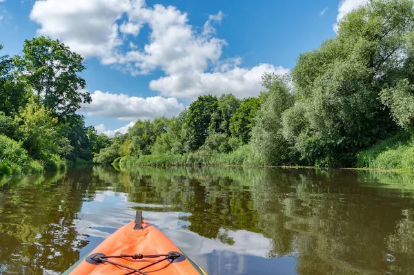 Journey in kayaks on the river. Active rest on the water. Canoeing on a quiet river.