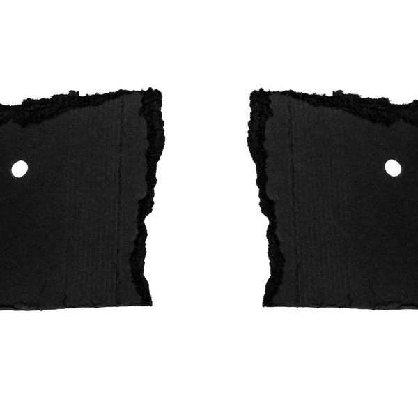 Beyaz Arkaplanda Delik Yumrukları Olan Siyah Karton Parçalar