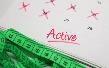 Takvimde mezura ile etkin metin. Fiziksel aktivite kavramı, fitness hedefleri ve sağlık izleme.