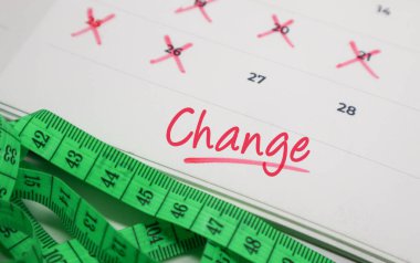 Takvimdeki metni mezura ile değiştir. Vücut dönüşümü, sağlık hedefleri ve diyet izleme kavramı.