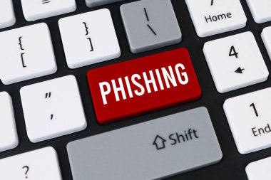 Bilgisayar klavyesindeki kırmızı phishing tuşu. Siber suç kavramı, online dolandırıcılık ve kimlik hırsızlığı savunmasızlığı.