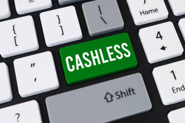Sayısal ödemeler için CASHLESS okunan beyaz metin ile belirgin yeşil bir anahtar içeren bir bilgisayar klavyesinin yakın plan görüntüsü.
