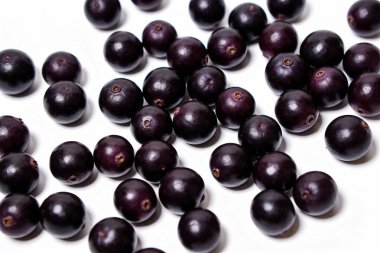 These small, round, deep purple berries are known for their antioxidant properties and are often used in smoothies and bowls