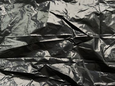Gerçekçi plastik kaplama arka plan. Yüzeyi buruşuk, kare polietilen parçalar, gerilmiş film ambalaj dokusu, buruşuk selofan paketi.