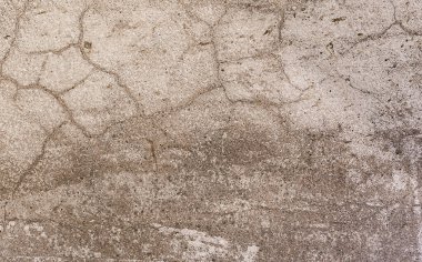 Siyah lekeli ve çatallı desen kahverengi beton duvar.