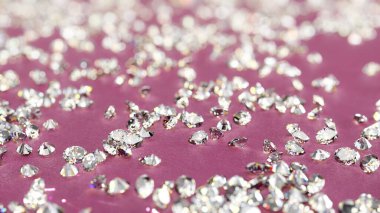 Sparkling Loose Diamonds On Pink Background With Shallow Depth Of Field