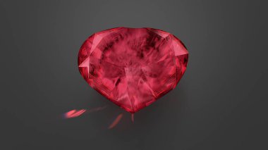 Red Beryl Heart Shaped Gemstone On Dark Grey Background