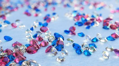 Blue, Pink And Colorless Topaz On Light Blue Background
