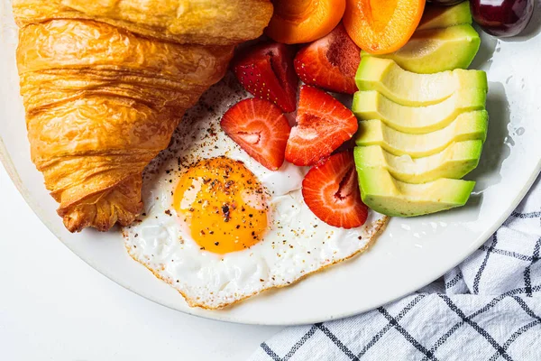 Breakfast Plate Croissant Avocado Fried Egg Salad Fruit Close — 图库照片