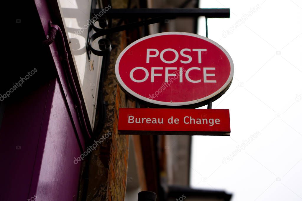 Saffron Walden, Essex, UK - January 12, 2024: British Post Office hanging sign with Bureau de Change