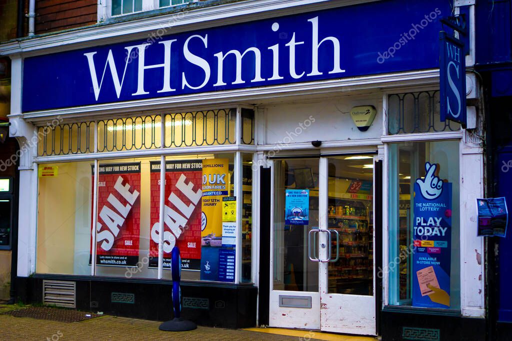 Saffron Walden, Essex, UK - January 12, 2024: WHSmith stationery and book shop with sale and lotto signs in the window