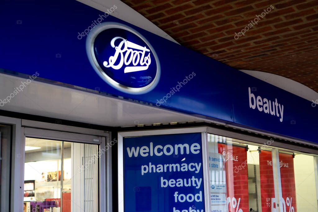 Saffron Walden, Essex, UK - January 12, 2024: Boots the chemist overhead shop front sign