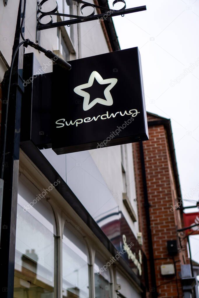 Saffron Walden, Essex, UK - January 12, 2024: Superdrug chemist and beauty shop hanging sign with logo