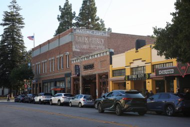 Old Towne Orange, California, USA - July 13th, 2025 Circle of Orange Historic Traffic Roundabout at Plaza Park on a Sunny Day With Stores