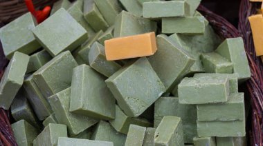 Homemade green soap with extra virgin olive oil. Natural traditional Anatolian soap in a wicker basket. Organic and laurel hair