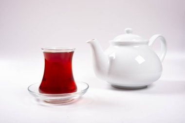 Cup of tea and teapot, a cup of tea and porcelain teapot isolated on a white background