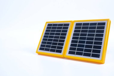 Portable solar panel isolated on white background. Small solar battery cell panel. Mini charging system. Renewable and clean energy concept