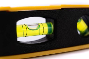 Spirit level on white background, close up, macro shot