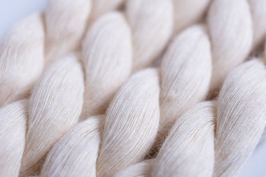 Close up of natural cotton rope. Thick cotton rope showing detail of threads and fibres, macro shot