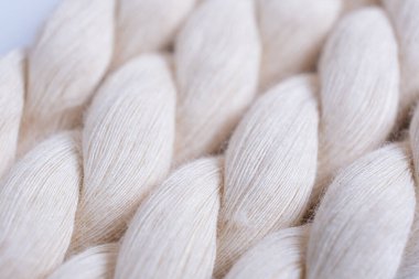 Close up of natural cotton rope. Thick cotton rope showing detail of threads and fibres, macro shot