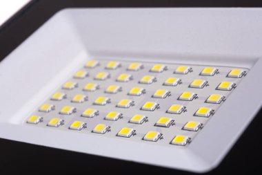 LED spotlight lamp close up. LED diodes background. Waterproof outdoor flood lights, reflector