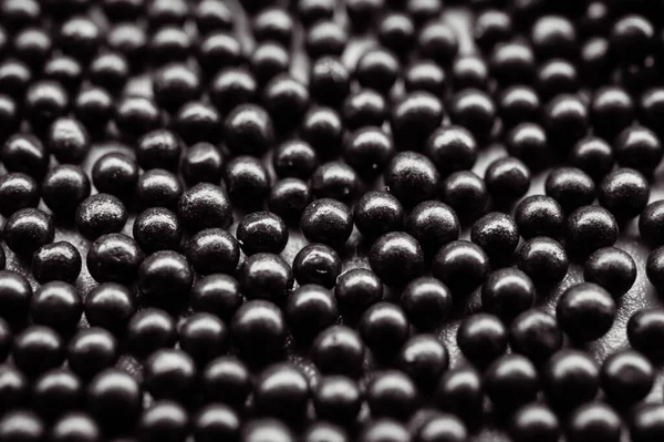 Koyu küresel çelik bir fotoğraf, aşındırıcı patlamalar ve yüzey hazırlıkları için kullanılan bir medya..