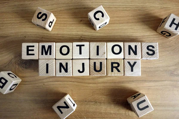 Texto Emociones Lesiones Bloques Madera Escritorio —  Fotos de Stock