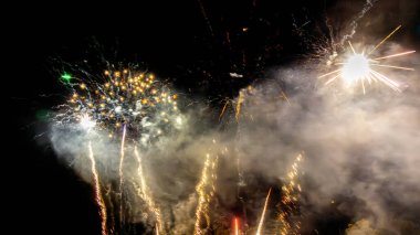 Colored fireworks in french summer sky