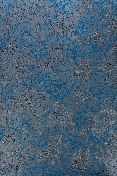 Rastgele, kesişen çizgilerle desenli arka plan. Koyu mavi desen ve sedef mavisi kayganlaştırıcı çelik mavi arka plana yerleştirilir. Döşeme, dekor, modern tasarım ve aksan öğeleri için kullan.