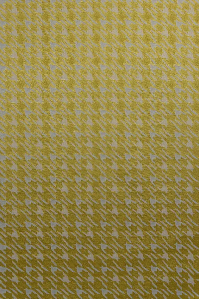 Çelişkili bir houndstooth deseni (pied-de-poule) olan düz bir jacquard arkaplanı. Parlak altın sarısı arka plan, sessiz gri zeytin motifinin altını çiziyor. Bu malzeme modern iç mekanlar, aksan duvarları ve giyim tasarımları için kullanılır..
