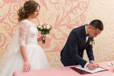 The groom and the bride at the wedding palace