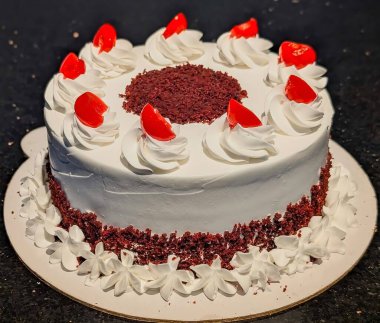 Elegant Red Velvet Cake with Whipped Cream and Cherries