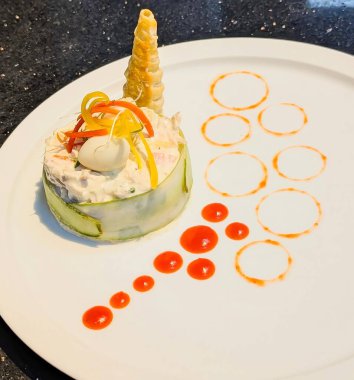 Close-up of a fresh creamy vegetable salad with mayonnaise dressing, garnished with colorful bell peppers, herbs, and elegant plating. Perfect for healthy food concepts, restaurant menus.