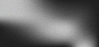 İnce gri bir arka plan, ince bir tahıl dokusu ve yumuşak ışık çizgileri var. Koyu griden açık griye geçiş ve dağınık ışık efektleri..