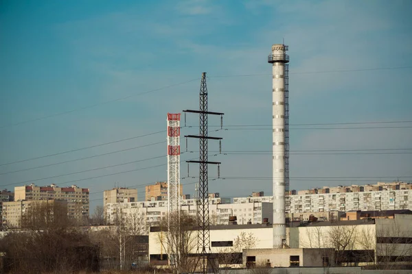 Factory with chimney on city background, bad ecology