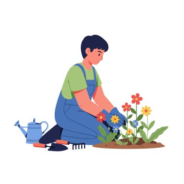 Bahçe aletleriyle bahçeye renkli çiçekler eken adam.