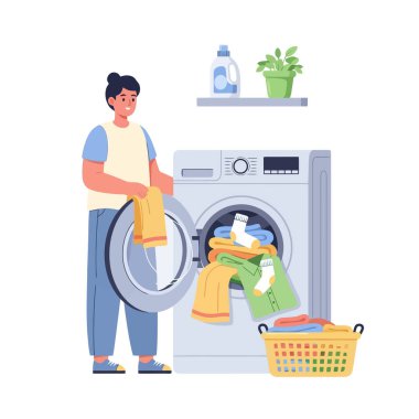 Ev işleri için çamaşır makinesiyle çamaşır yıkayan bir adam.
