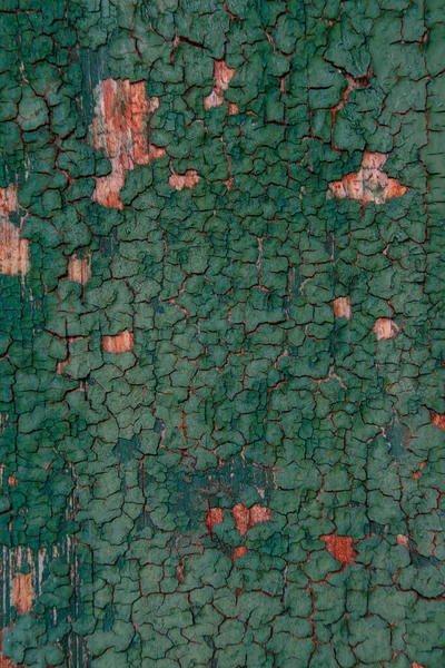 Tahtaların üzerinde eski çatlak yeşil boya. Desing için arkaplan.