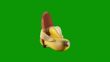 Yeşil arka planda yeşil yapraklı bir muz.