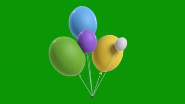 yeşil arka plan üzerinde renkli balonlar