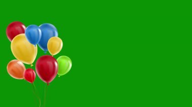 Yeşil arka planda izole edilmiş renkli balonlar.